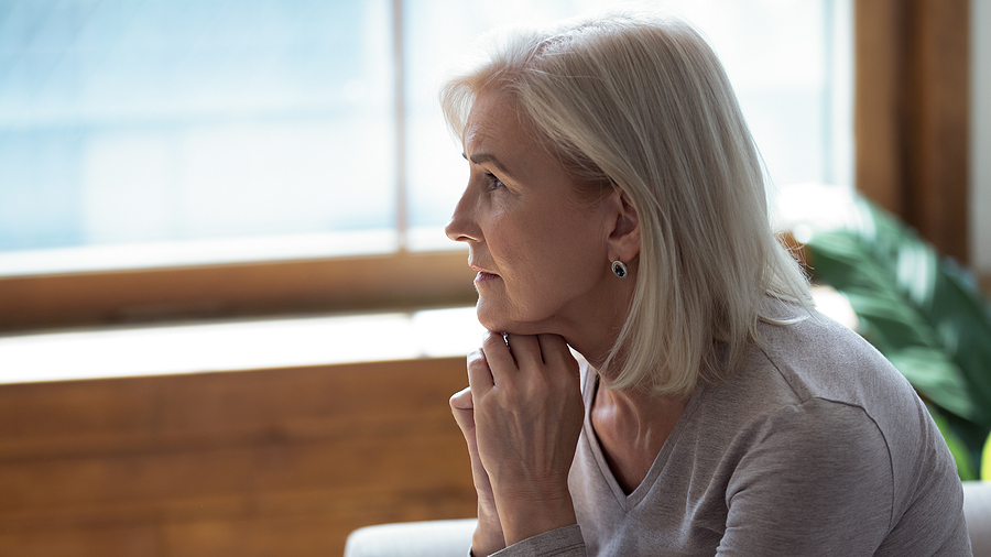 Unhappy Lonely Older Woman Sitting Alone And Thinking About Prob