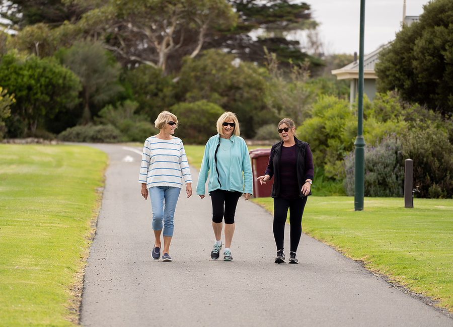Happy Active Senior Citizen Women Walking And Training Together