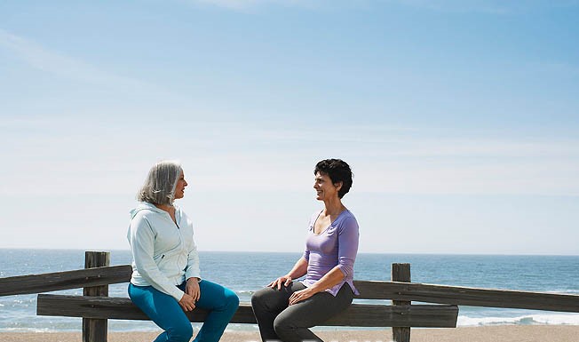 Middle Aged Women Having A Conversation At The Beach