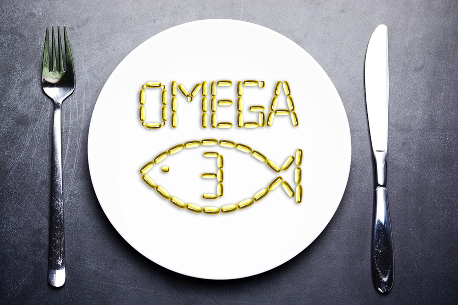 Omega 3 From Salmon Oil Capsules On White Plate With Fish Shape